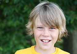 Preteen boy with healthy smile
