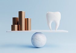 Stacks of coins balanced against tooth
