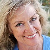 Senior woman with beautiful smile and blue shirt