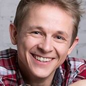 Young man with healthy smile and plaid shirt