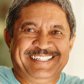 Senior man with mustache and full healthy smile