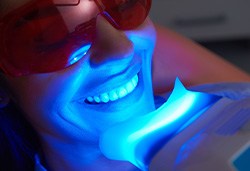 Patient undergoing in-office whitening treatment
