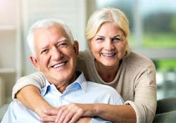 Older couple enjoying the many benefits of dentures