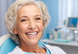 Smiling senior woman in dental treatment chair