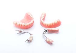 Full and partial dentures displayed against neutral background