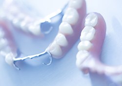 Samples of partial dentures lying on a table waiting for a patient to receive