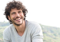 A young man smiling