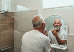 man brushing his teeth