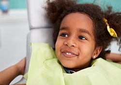 Little girl smiling in dental chair