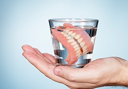 Full dentures in glass of water