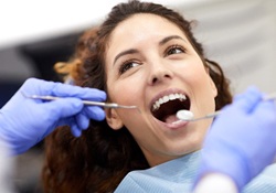 A woman having her teeth checked