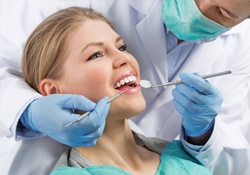 Dentist assistant with patient