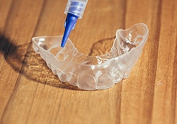 take-home whitening tray with whitening gel syringe
