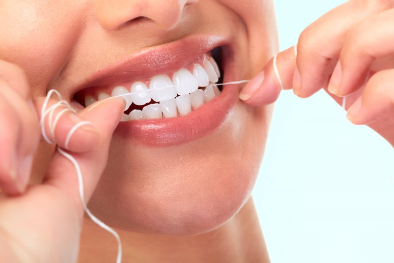 A Reminder from Your Dentist Flossing Freshens Your Breath!