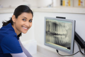 woman looking at oral x-ray