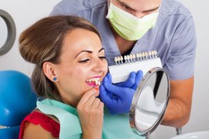 a woman trying porcelain veneers