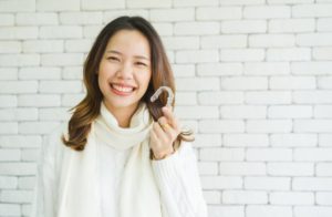 professional woman enjoying Invisalign benefits