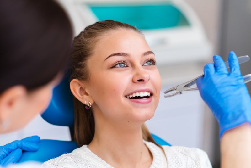 girl smiling during tooth extraction