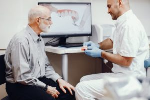 dentist talking to adult patient