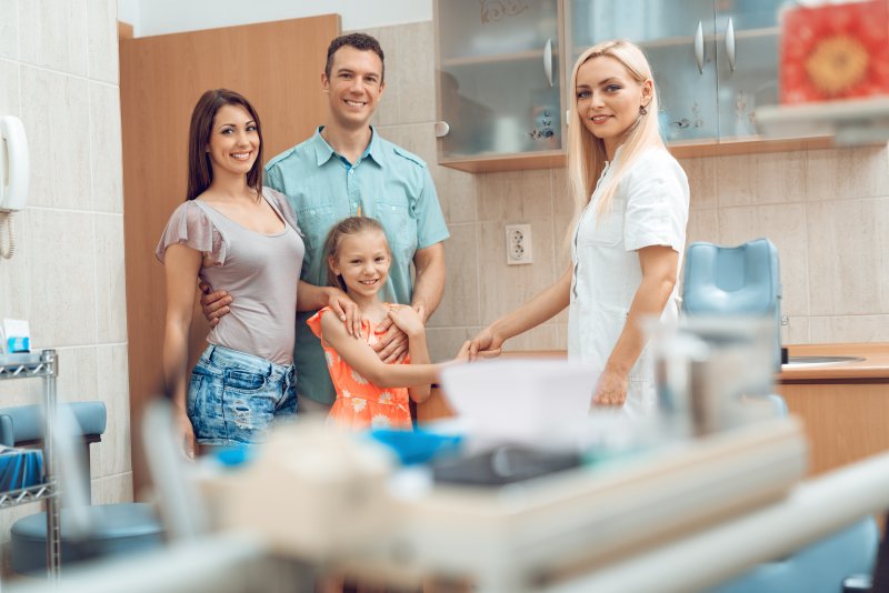 parents and child visiting a family dentist in Harrisonburg
