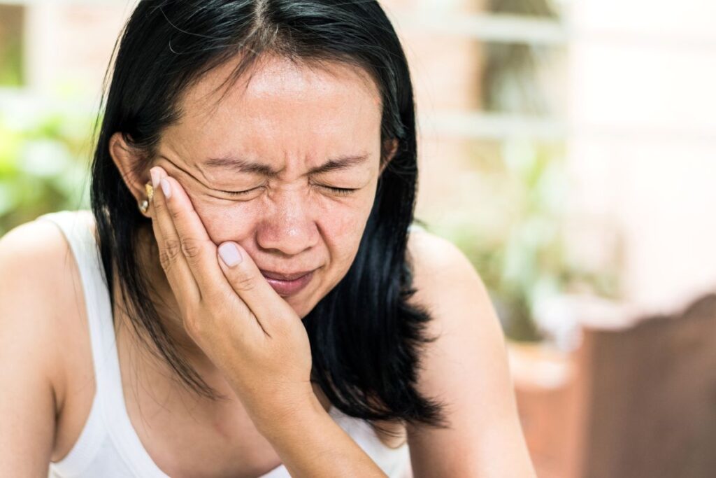 A woman with facial pain